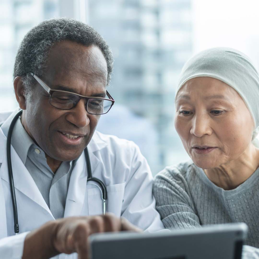 Doctor explaining medical results of cancer blood test to patient